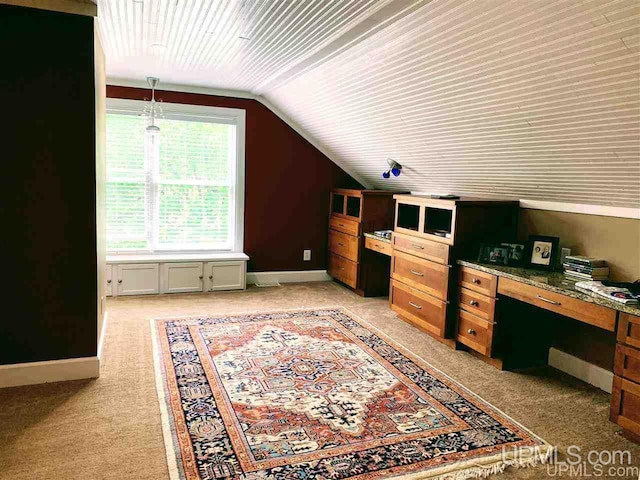 office area with light carpet and lofted ceiling