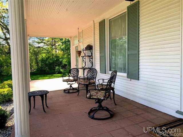 view of patio featuring a porch