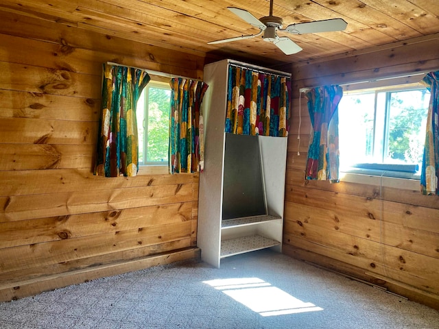 unfurnished bedroom with carpet flooring and wooden ceiling