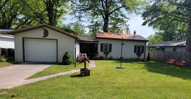 ranch-style house featuring a front yard and a garage