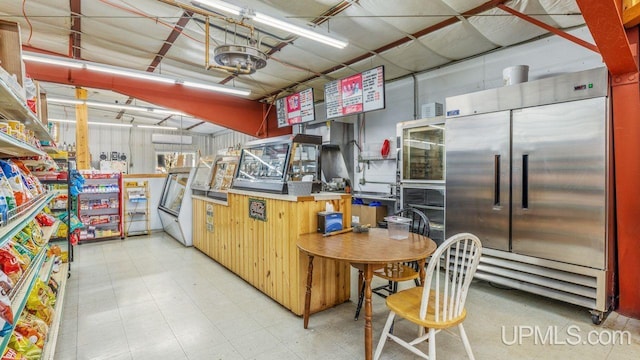 kitchen featuring tile floors and built in fridge