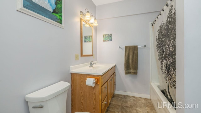 full bathroom featuring tile flooring, oversized vanity, toilet, and shower / bath combo