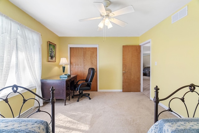 bedroom featuring a closet, ceiling fan, and carpet floors