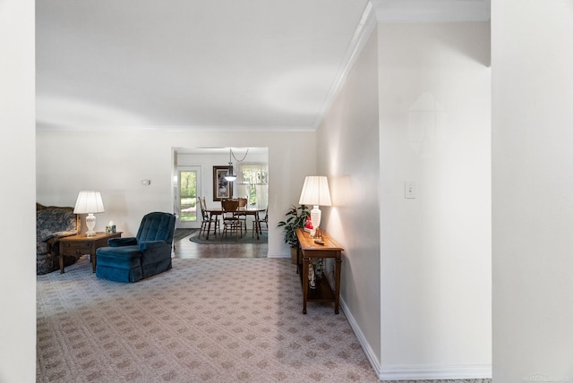 living room featuring carpet floors and crown molding