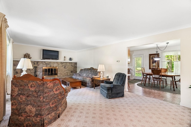 carpeted living room with crown molding and a fireplace