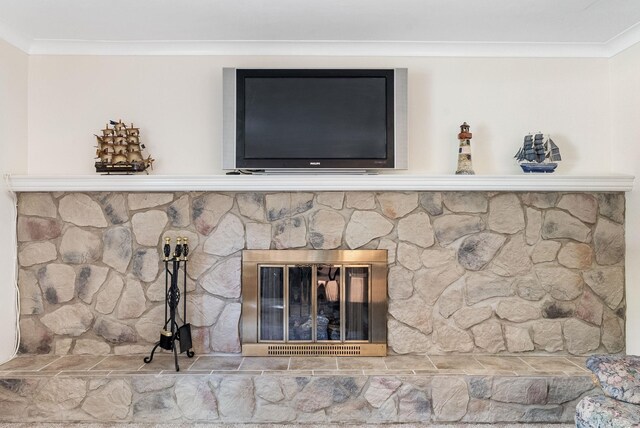 details with a fireplace and crown molding