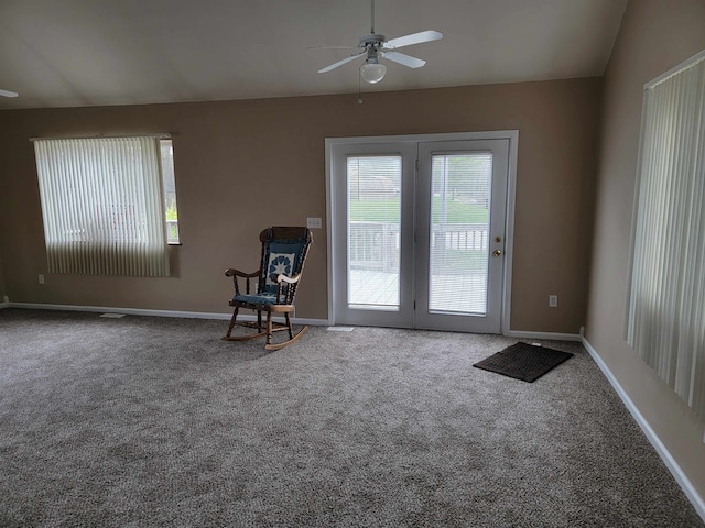 unfurnished room featuring vaulted ceiling, ceiling fan, and carpet floors