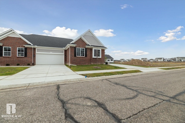 view of front of home with a front yard and a garage