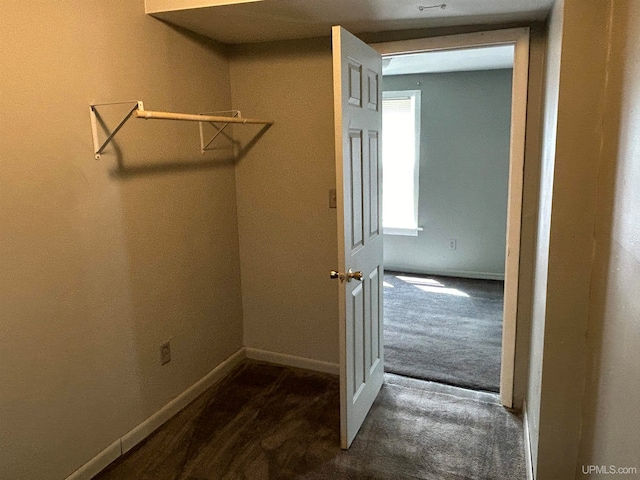 interior space featuring dark colored carpet