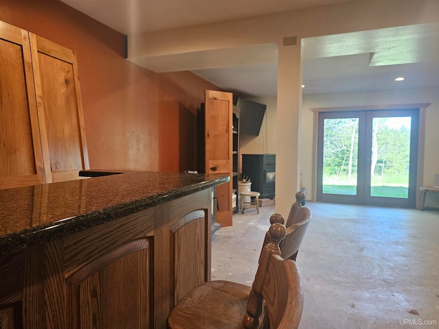 kitchen featuring dark stone countertops