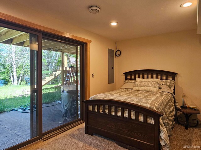 carpeted bedroom featuring access to outside