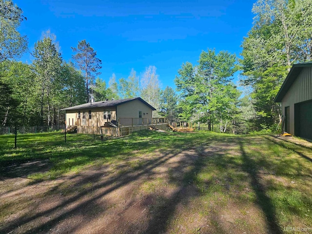 view of yard with a wooden deck