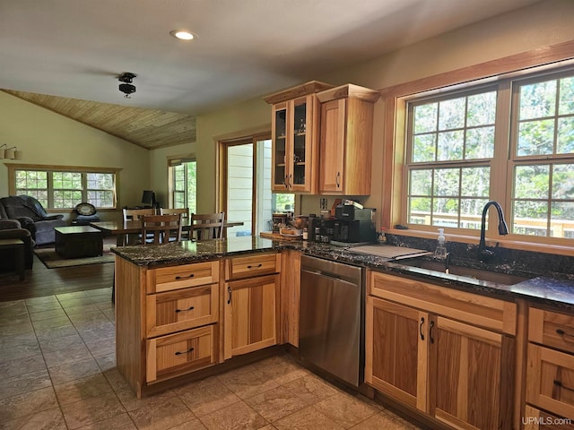 kitchen with sink, lofted ceiling, dishwasher, and light tile floors