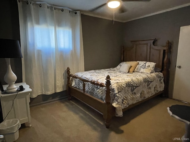 bedroom featuring carpet, ceiling fan, and crown molding