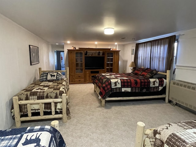 carpeted bedroom with radiator