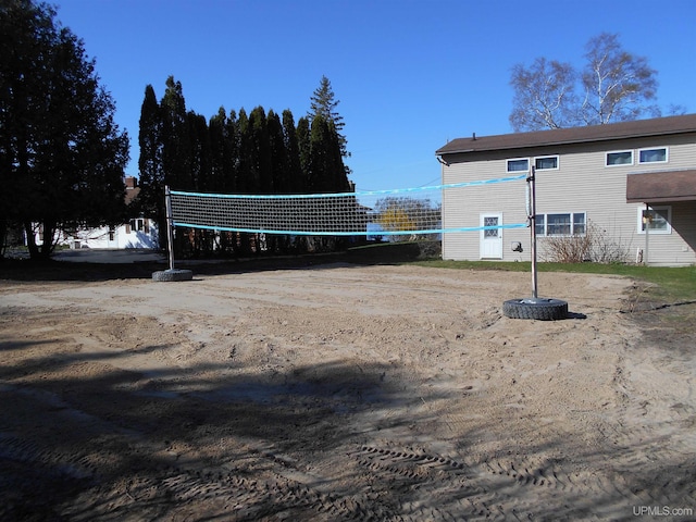 surrounding community featuring volleyball court