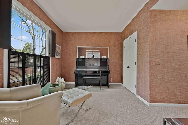 carpeted living room with a wealth of natural light and ornamental molding