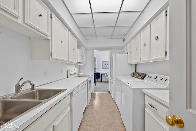 washroom featuring separate washer and dryer and sink