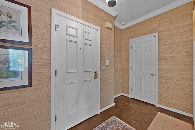 foyer entrance with dark parquet flooring and ornamental molding