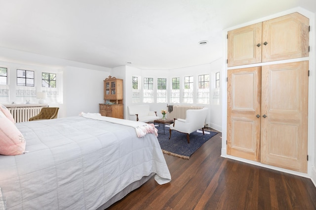 bedroom featuring dark wood-style flooring and visible vents