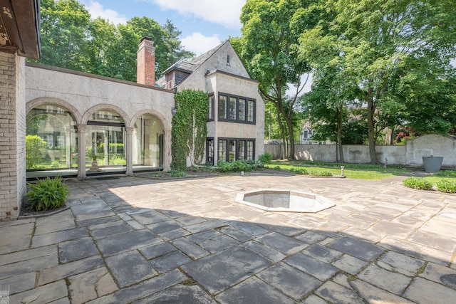 view of patio / terrace featuring fence