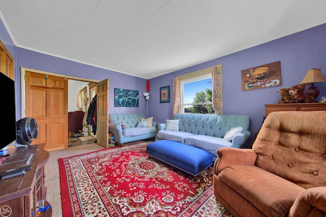 living room featuring carpet flooring and ornamental molding