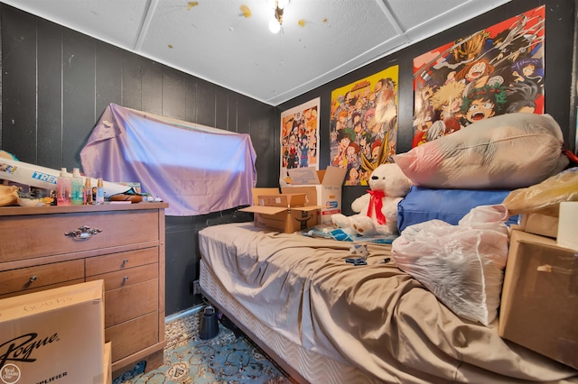 bedroom with wooden walls