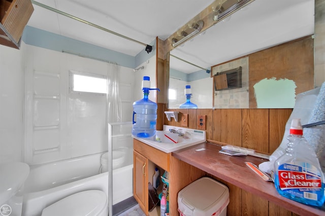 bathroom featuring shower / washtub combination and toilet