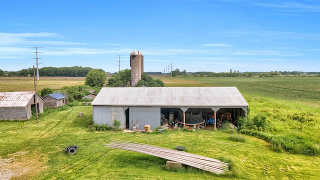 view of outdoor structure with a rural view