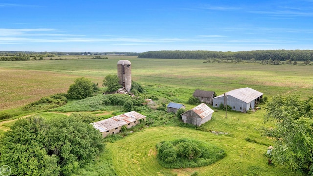 birds eye view of property with a rural view