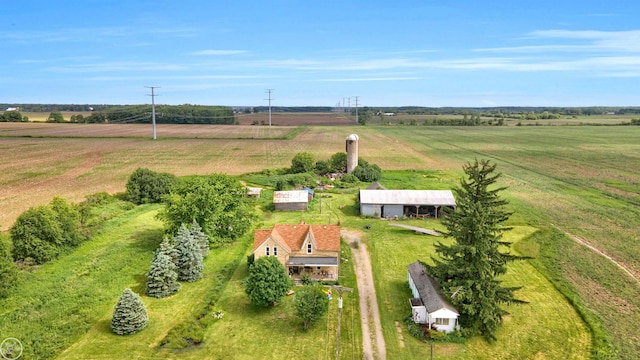 birds eye view of property with a rural view