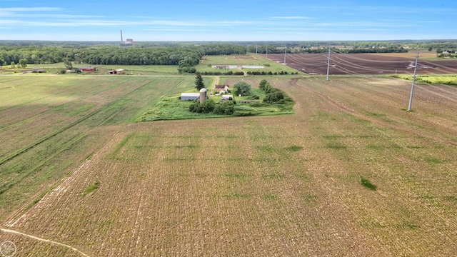 birds eye view of property with a rural view