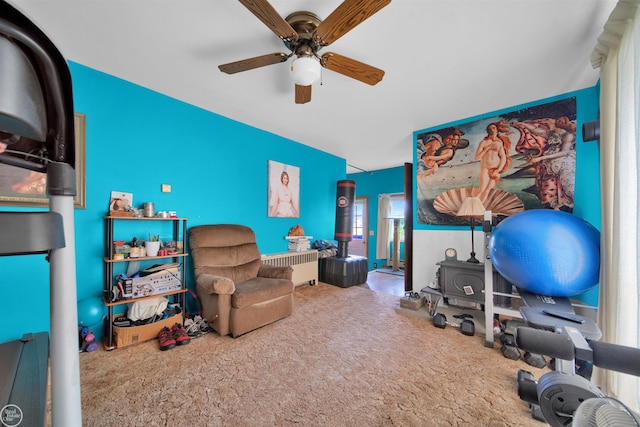 carpeted office space featuring ceiling fan