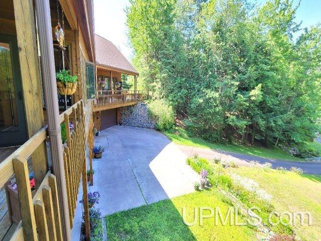 view of patio / terrace featuring driveway and an attached garage