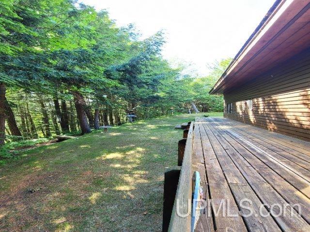 view of yard with a wooden deck