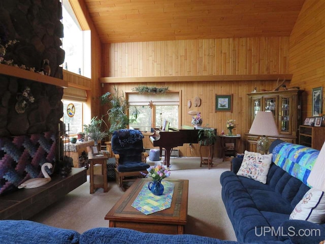 living room featuring high vaulted ceiling, carpet, wooden ceiling, and wooden walls