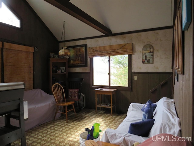 living room featuring a wainscoted wall, wallpapered walls, and vaulted ceiling with beams