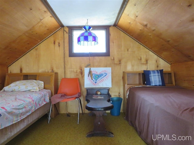 bedroom featuring lofted ceiling, carpet floors, wooden ceiling, and wooden walls