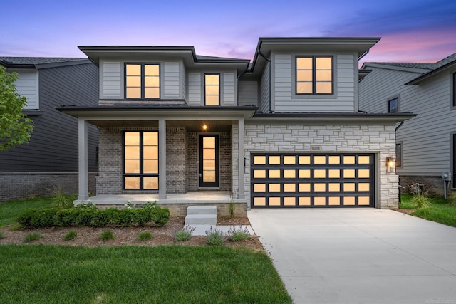 view of front of home featuring a porch and a garage