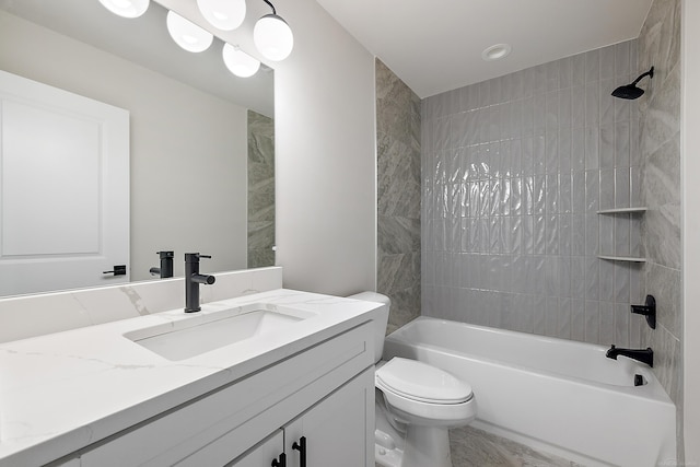 full bathroom featuring vanity, toilet, and tiled shower / bath