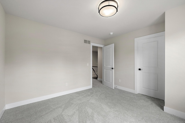 unfurnished bedroom with light colored carpet