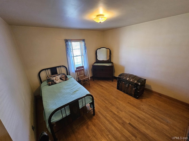 bedroom featuring wood-type flooring