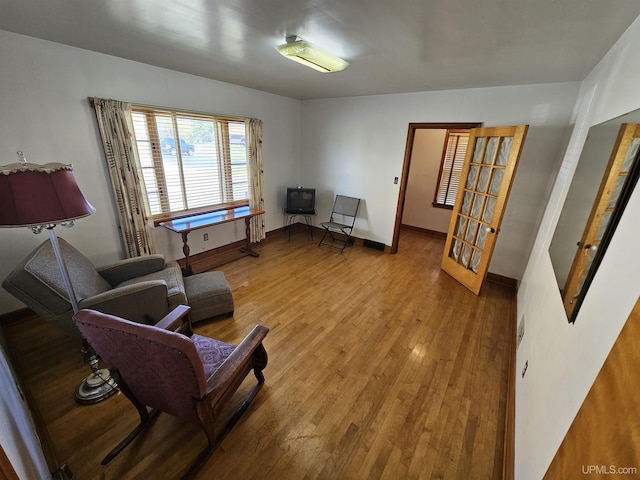 living area featuring hardwood / wood-style floors