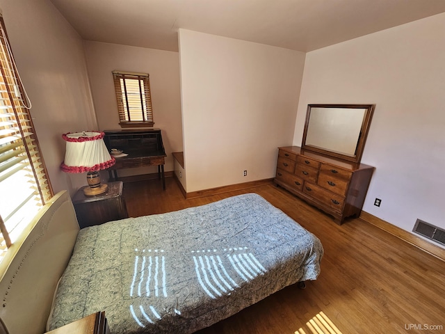 bedroom featuring hardwood / wood-style floors