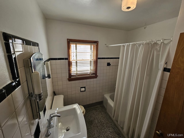 full bathroom featuring shower / tub combo, toilet, tile walls, and sink