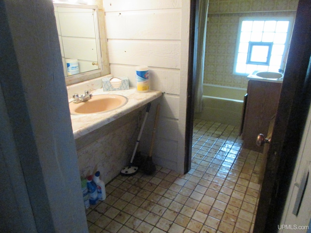 bathroom featuring tile patterned flooring and vanity