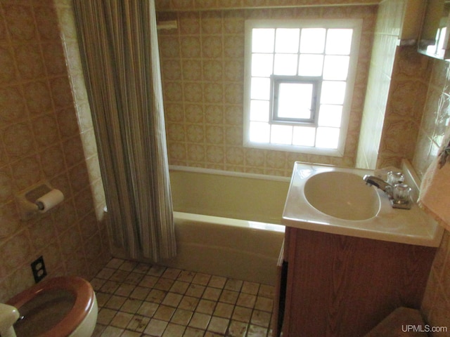 full bathroom with tile patterned floors, vanity, shower / bath combination with curtain, and toilet