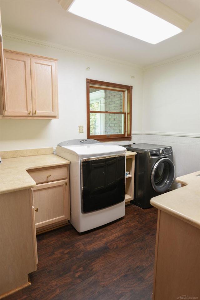 kitchen featuring dark hardwood / wood-style floors, light brown cabinets, washer and dryer, and crown molding