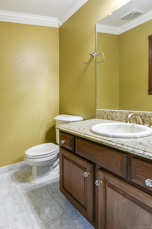 bathroom with tile floors, ornamental molding, toilet, and vanity