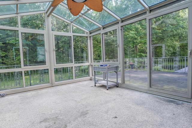 unfurnished sunroom featuring ceiling fan and lofted ceiling